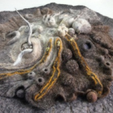Close up detail of 3 dimensional abstract wall hanging